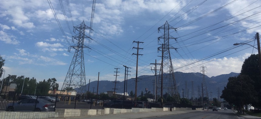 Electrical grid transmission towers are seen in Pasadena, Calif., Saturday, Aug. 15, 2020. The operator of the state's power grid declared an emergency Friday evening, Aug. 14, and ordered utilities to shed their power loads.