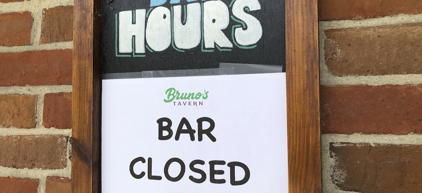 A sign hangs outside Bruno’s Tavern in New Orleans on Tuesday, July 14, 2020.