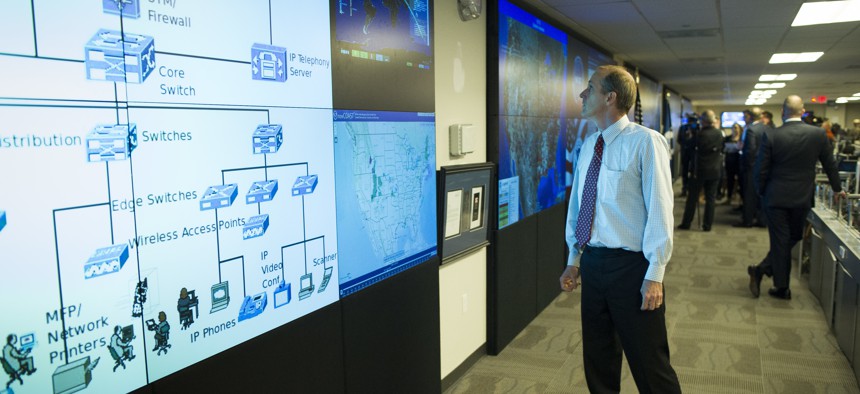 One of the large video screens is checked in the Department of Homeland Security's National Cybersecurity and Communications Integration Center (NCCIC) in Arlington, Va., Wednesday, Aug. 22, 2018. 