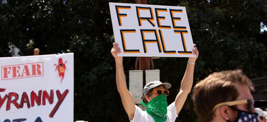 Protesters angry over mask mandates and shutdown orders gather in Los Angeles in May.