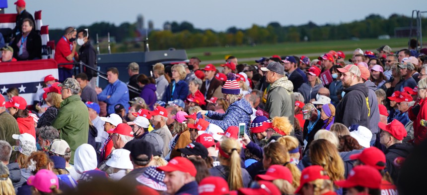People listen as President Donald Trump speaks at a rally on Sept. 17 in Mosinee, Wisconsin.