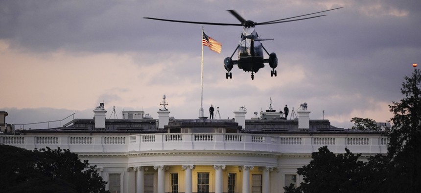 President Donald Trump arrives back at the White House aboard Marine One, Monday evening, Oct. 5, 2020 in Washington, after being treated for COVID-19 at Walter Reed National Military Medical Center. 