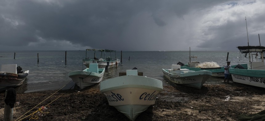 Boats sit closer to the shore after they were secured by fishermen preparing for the arrival of Hurricane Delta in Puerto Juarez, Cancun, Mexico, Tuesday, Oct. 6, 2020. The storm is expected to hit the U.S. Gulf Coast later this week.