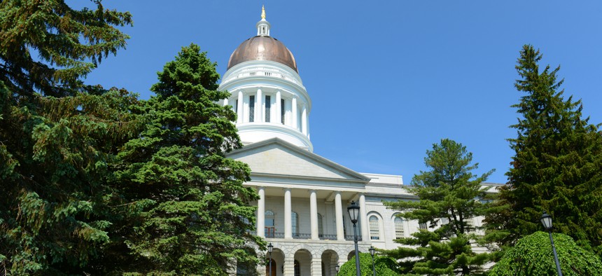 The Maine Statehouse. Maine lawmakers were split whether 2020 was the moment to kill the commission or invest heavily in a public defender office to bolster it.