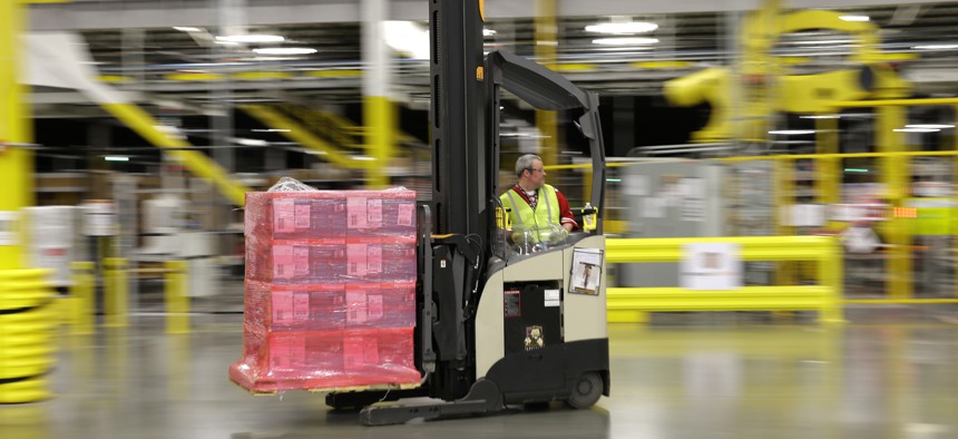 A forklift operator moves a pallet of goods at a Amazon.com fulfillment center in DuPont, Wash.