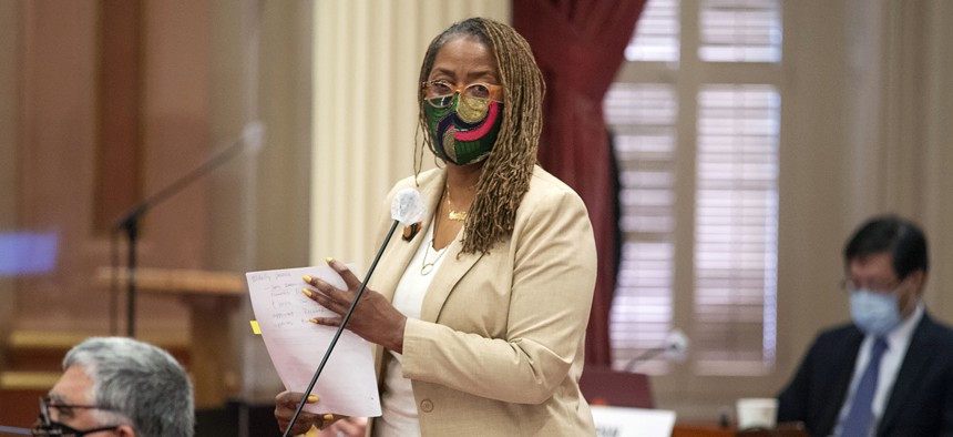 State Sen. Holly Mitchell, D-Los Angeles, talks to fellow members in Sacramento, Calif., on Aug. 31, 2020.