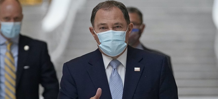 Utah Gov. Gary Herbert gives a thumbs up as he walks through the Capitol rotunda to a Covid-19 briefing Monday, Nov. 9, 2020, a day after issuing a statewide mask mandate.