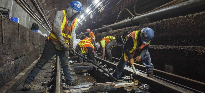 This June 15, 2019 photo provided by the Metropolitan Transportation Authority shows workers during the L Project subway tunnel rehabilitation, in New York.