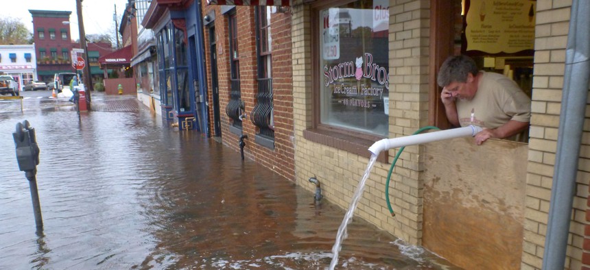 Sveinn Storm pumps water out of his flooded Storm Bros. Ice Cream Factory store in downtown Annapolis, Md. on Oct. 30, 2012, in the aftermath of Hurricane Sandy.