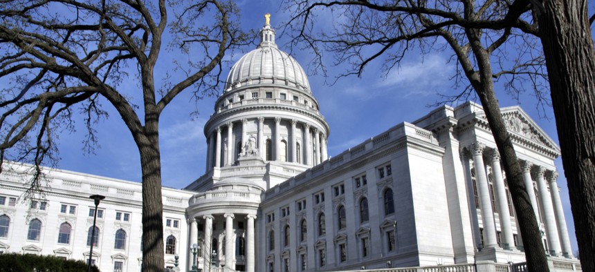 The Wisconsin state capital building in Madison. The dispute over how to respond to COVID-19 is expected to spill into next year in Wisconsin.