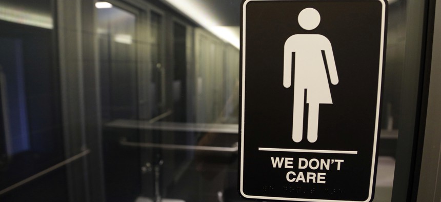 In 2016, a gender free sign hung outside a restroom at 21c Museum Hotel in Durham, N.C. A 3 1/2-year ban on local ordinances aimed at protecting LGBTQ rights in North Carolina expired on Dec. 1, 2020.