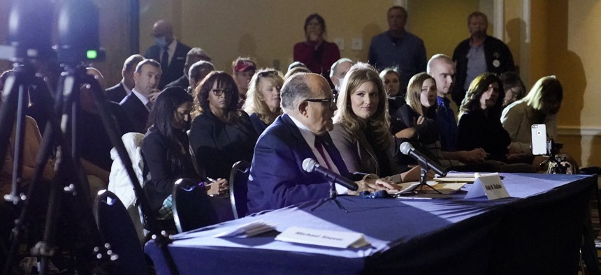Rudy Giuliani, center, speaks at a hearing of the Pennsylvania State Senate Majority Policy Committee, Wednesday, Nov. 25, 2020, in Gettysburg, Pa.