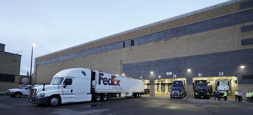 A truck loaded with the Pfizer-BioNTech COVID-19 vaccine leaves the Pfizer Global Supply Kalamazoo manufacturing plant in Portage, Mich., Sunday, Dec. 13, 2020. 