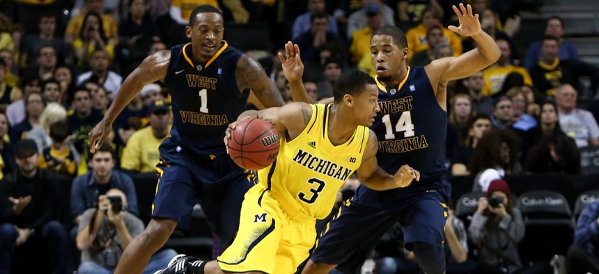 The University of Michigan basketball team faces off against West Virginia University.