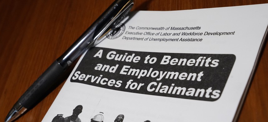 A booklet describing unemployment benefits is seen on a desk, Thursday, Nov. 5, 2020, in North Andover, Mass.