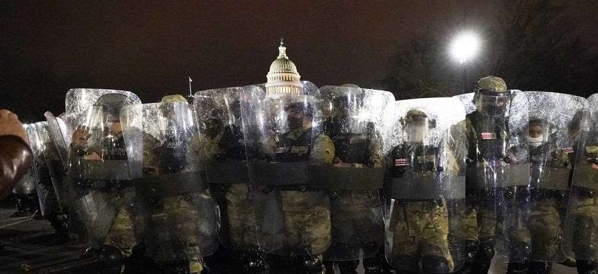 DC National Guard stand outside the Capitol, Wednesday, Jan. 6, 2021, after a day of rioting protesters.