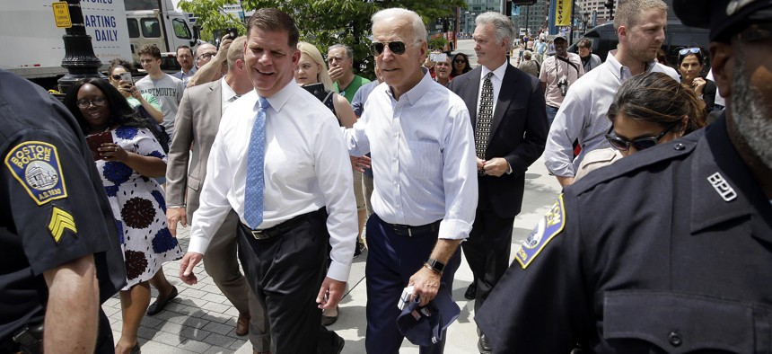 President-elect Joe Biden walks with Boston Mayor Marty Walsh, left, on June 5, 2019, in downtown Boston.