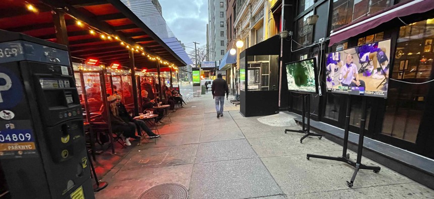Patrons watch sports outside in the frigid January 2021 weather as dining is restricted to 'outdoors onl'y during the coronavirus pandemic in New York City.