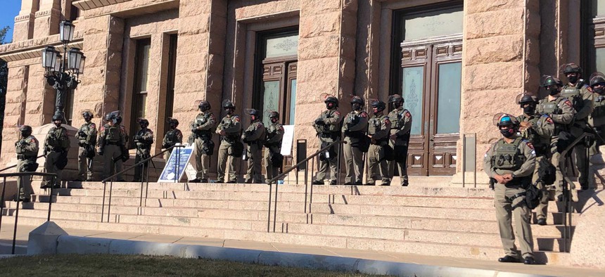 Texas state troopers wearing riot gear stand guard outside the Capitol in Austin, Texas, on Tuesday, Jan. 12, 2021, for the opening of the legislative session. 