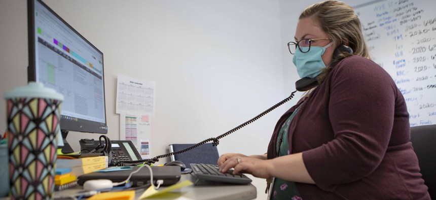 A staff member at the Umatilla County Public Health Department COVID-19 contact tracing center in Pendleton, Ore. in July 2020.