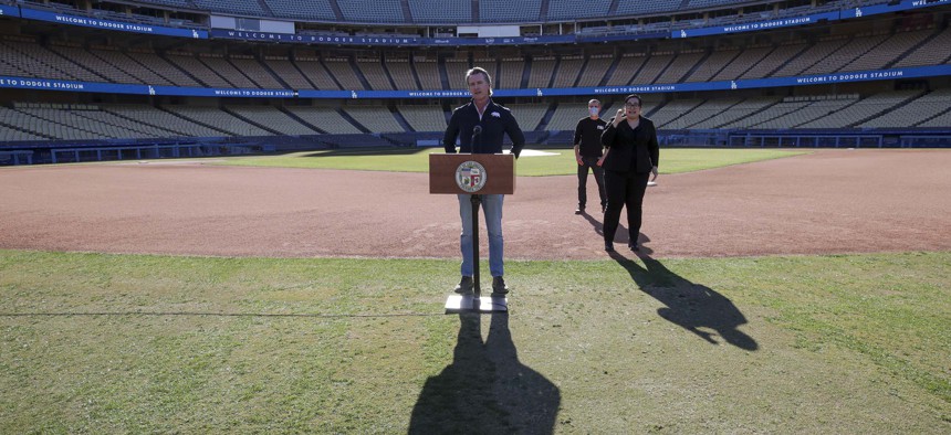 Governor Gavin Newsom addresses a press conference held at the launch of a mass COVID-19 vaccination site at Dodger Stadium, Friday, Jan. 15, 2021, in Los Angeles.