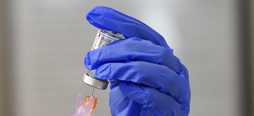 A nurse prepares a COVID-19 vaccine Thursday, Jan. 28, 2021 in Pittsboro, N.C.