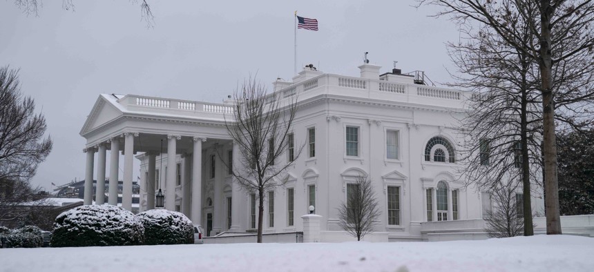 Snow covers the ground at the White House, Monday, Feb. 1, 2021, in Washington.