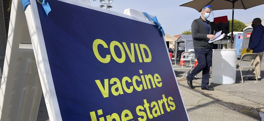 A sign is shown at a COVID-19 vaccine site in the Bayview neighborhood of San Francisco, Monday, Feb. 8, 2021. 
