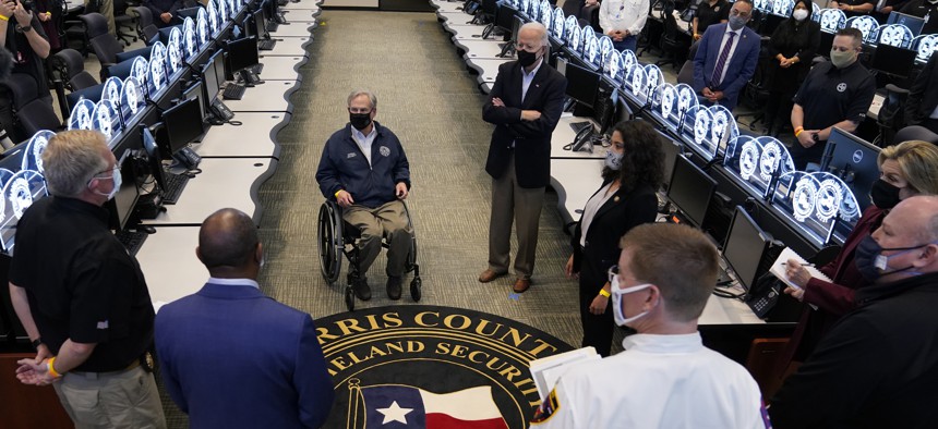 President Joe Biden tours the Harris County Emergency Operations Center with Texas Gov. Greg Abbott, Friday, Feb. 26, 2021, in Houston. 