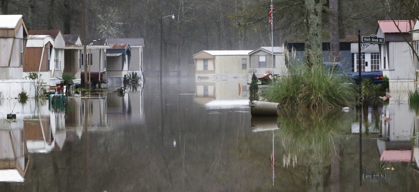 Standing floodwater from the Pearl River still surrounds a number of mobile homes in the back portion of the Harbor Pines community in Ridgeland, Miss., Tuesday, Feb. 18, 2020. 