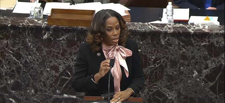 House impeachment manager Del. Stacey Plaskett, D-Virgin Islands, answers a question from Sen. Jacky Rosen, D-Nev., during the second impeachment trial of former President Donald Trump.