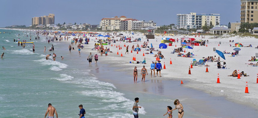 Beachgoers take advantage of the sun, sand, and surf as they spend time on Clearwater Beach Tuesday, March 2, 2021, in Clearwater, Fla., a popular spring break destination, west of Tampa.