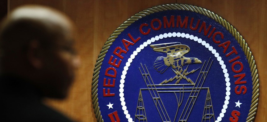 This Dec. 14, 2017, file photo, shows the seal of the Federal Communications Commission (FCC) before a meeting in Washington. 