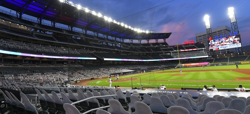 Cardboard cutouts of fans in the otherwise empty seats face the field during the sixth inning of a baseball game between the Atlanta Braves and Tampa Bay Rays in Atlanta, in this Thursday, July 30, 2020, photo. 