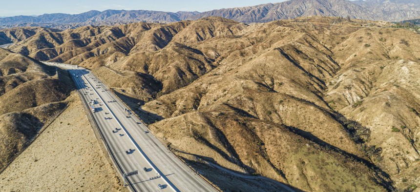 The aerial view of the Ronald Reagan Freeway in the California mountains, nearby Los Angeles and La Canada.