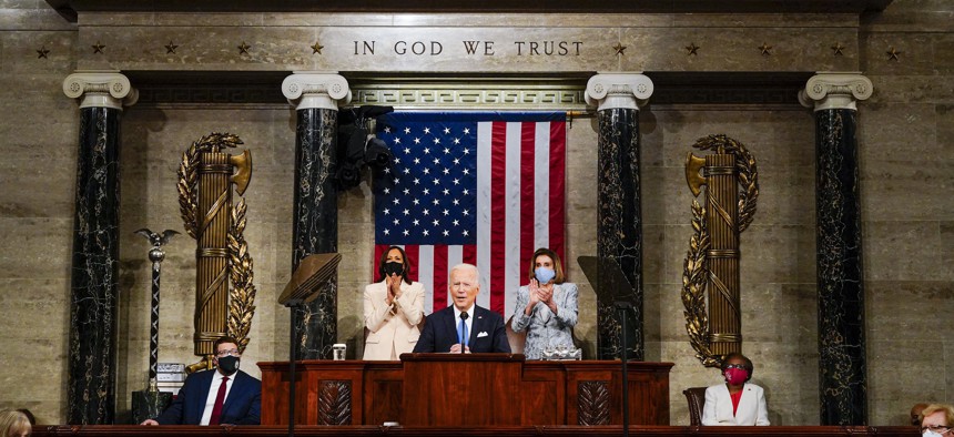 Vice President Kamala Harris and House Speaker Nancy Pelosi of Calif., stand and applaud as President Joe Biden addresses a joint session of Congress, Wednesday, April 28, 2021, in the House Chamber at the U.S. Capitol in Washington. 