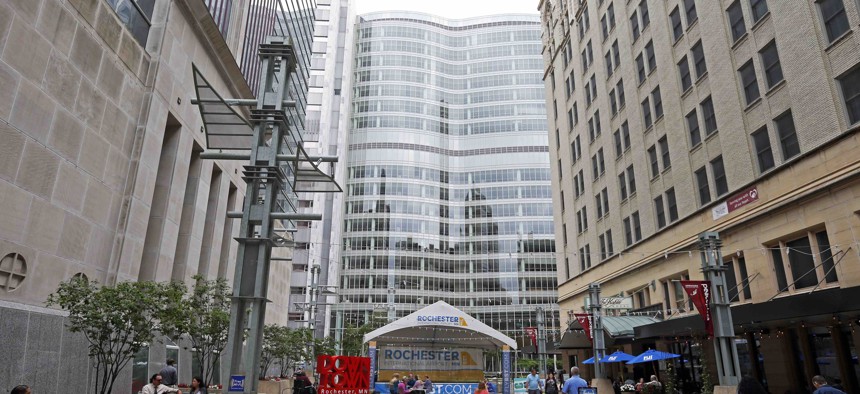 A pedestrian mall leads to the campus of the Mayo Clinic complex, center in Rochester, Minn.