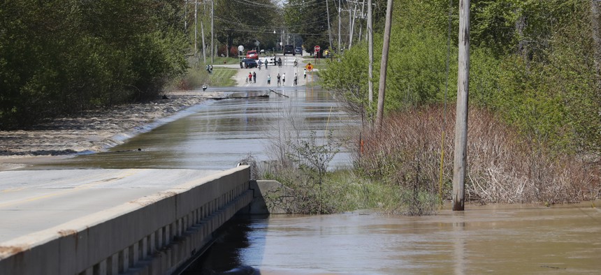 The Tittabawassee River overflows, Wednesday, May 20, 2020, in Freeland, Michigan. 