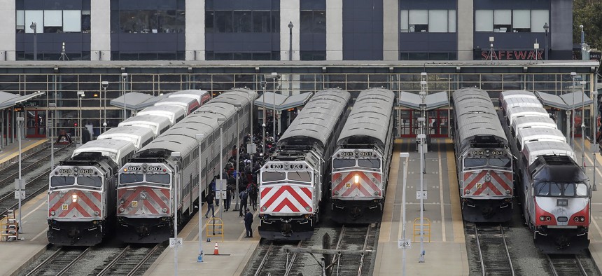 This Wednesday, Oct. 16, 2019, file photo shows trains at a Caltrain station in San Francisco.