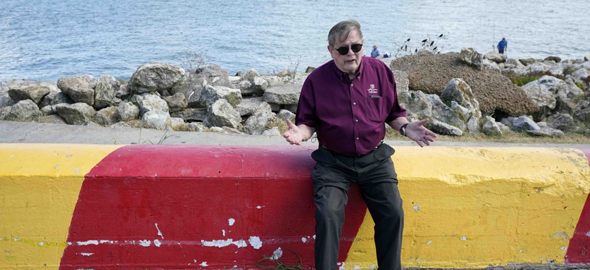 Bill Merrell, a professor in the Marine Sciences Department at Texas A&M University at Galveston and a former president of the school, sits along Galveston Bay as he talks about the Ike Dike project in Galveston, Texas.