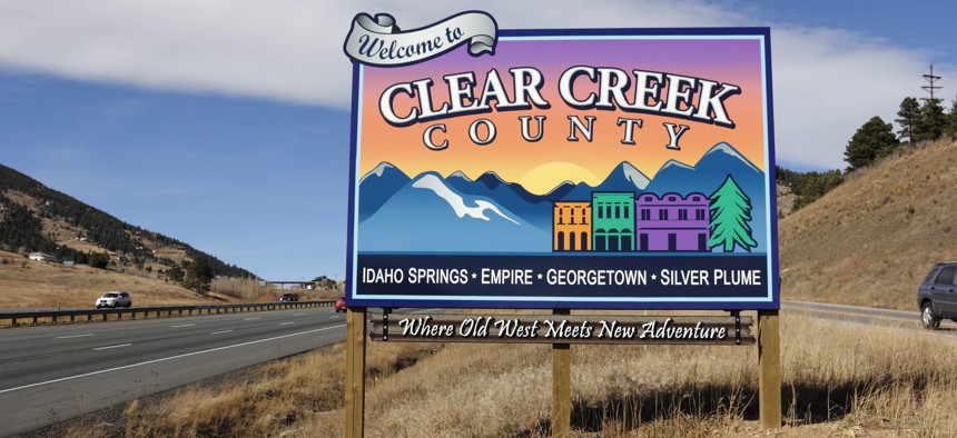 A welcome sign for Clear Creek County, Colorado along Interstate 70.