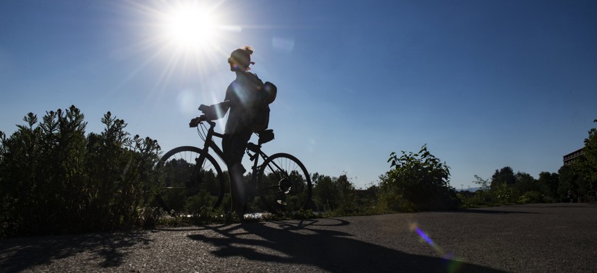 Gregory Matarazzo takes a break from cycling as the temperatures hovered over 100 degrees in Missoula, Montana, on Wednesday, June 30, 2021. 