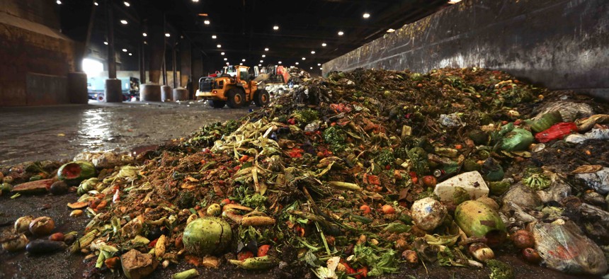 In this Aug. 29, 2018, photo, at the Waste Management facility in North Brooklyn, tons of leftover food sits piled up before being processed into "bio-slurry," in New York. The "bio-slurry" can be turned into methane gas at a nearby wastewater treatment plant. 