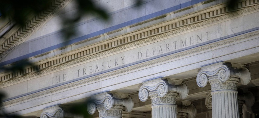 This June 6, 2019, file photo shows the U.S. Treasury Department building at dusk in Washington. 