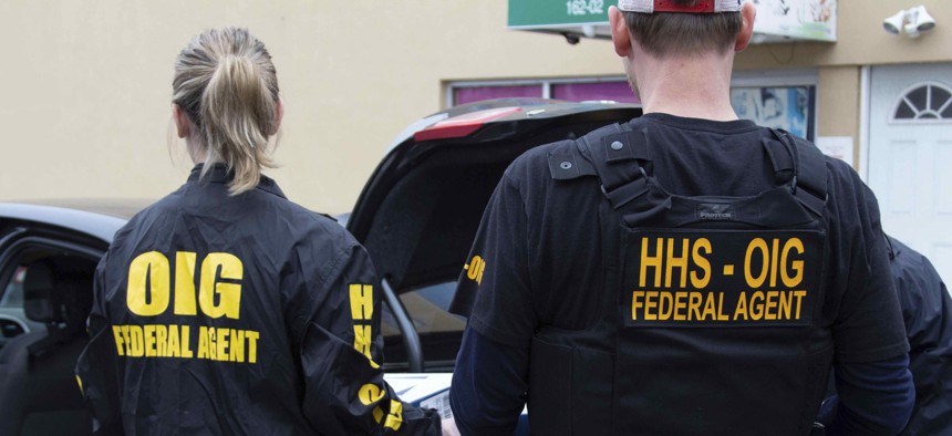 In this 2019 photo, federal agents from Department of Health and Human Services Office of Inspector General engage in search warrant operations in Atlanta. There are 22 IGs involved in a special oversight effort of Covid recovery programs.