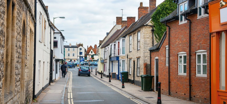 The report says that many urban streets in Europe, like this one in England, are narrow to accommodate more housing.