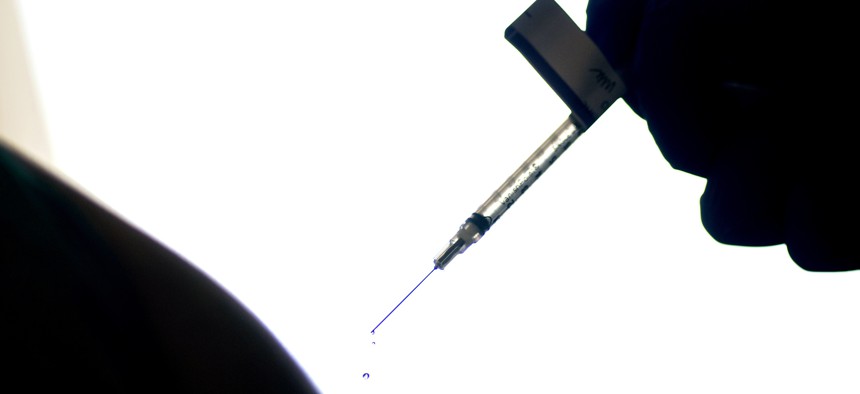  In this Dec. 15, 2020, file photo, a droplet falls from a syringe after a health care worker was injected with the Pfizer COVID-19 vaccine at a hospital in Providence, R.I. 