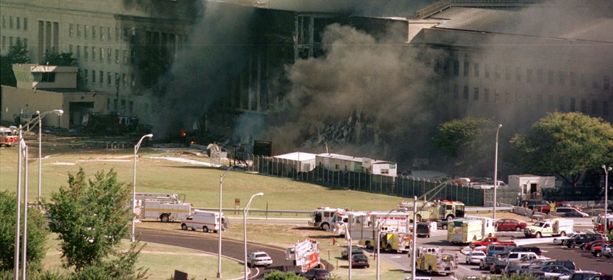 In this Sept. 11, 2001 file photo, the south side of the Pentagon burns after a plane crash in Washington. 