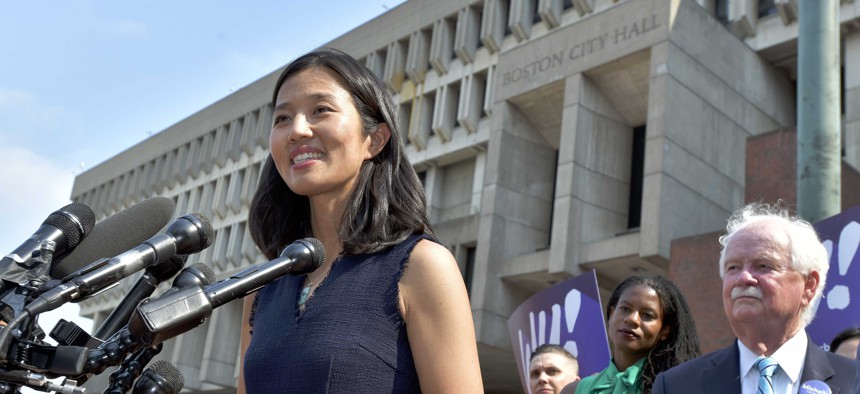 Mayoral Candidate City Councilor Michelle Wu speaks to reporters outside City Hall in Boston on Wednesday, Sept. 15, 2021. Wu placed first in a preliminary mayoral election that selected two top contenders from a field of five candidates all of whom are people of color, four of them women.