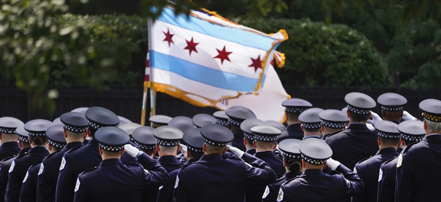 Chicago policer officers salute the colors as the body of slain Chicago police officer Ella French arrives at the St. Rita of Cascia Shrine Chapel Wednesday, Aug. 18, 2021, for a wake.  French was killed and her partner was seriously wounded during an Aug. 7 traffic stop on the city's South Side. 